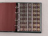 a book with a bunch of coins inside of it