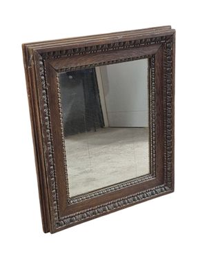Petit miroir de forme rectangulaire en bois sculpté à décor …