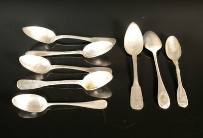 six silver spoons and two silver spoons on a black surface