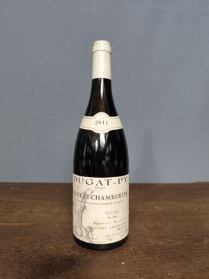 a bottle of wine that is sitting on a table