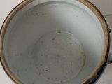 a blue and white bowl sitting on a table