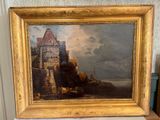 un tableau représentant un château, posé sur une étagère dans une pièce