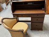 a chair that is sitting next to a desk in a room