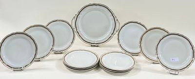 a large group of plates and bowls on a table