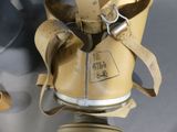 a gas mask with a gas can attached to it