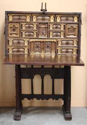 an old wooden desk with a drawer on it