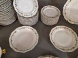 a lot of plates that are sitting on a table