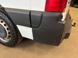 a close up of the rear end of a white van