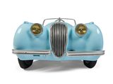 a blue toy car that is sitting on a white surface