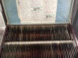 an old suitcase that has a grill inside of it