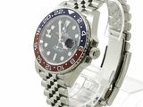 a rolex watch with a red, white and blue bezel