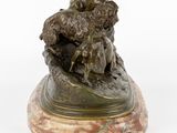 bronze sculpture of a dog and a cat on a marble base