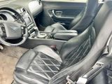 a picture of the interior of a car with leather seats