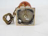 a small clock that is sitting on a table