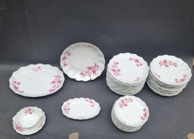 a lot of plates and bowls sitting on a table
