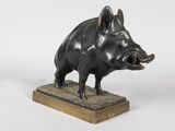 statue of a boar on a wooden base on a white background
