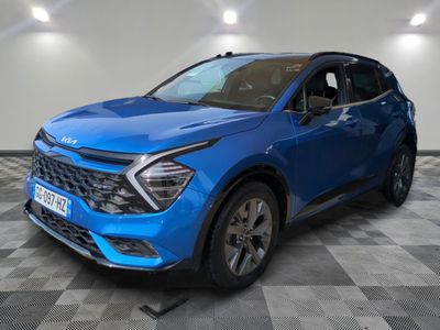 a blue suv parked in a room with a checkered floor