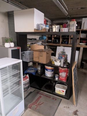 a refrigerator and a freezer in a garage