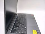 a laptop that is sitting on a white surface