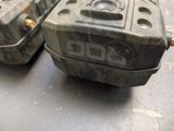 two camo boxes sitting on a table next to each other