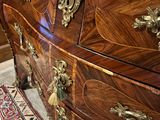 an image of a dresser in a room with a rug on the floor