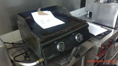 a stove that has a paper on top of it