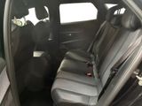 the back seats of a car with a clock on the side of it