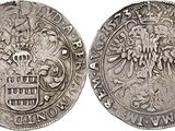 a silver coin with an eagle on the front and a shield on the back