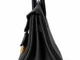 a black leather handbag on a white background