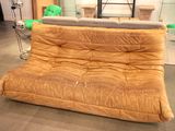 a couch that is sitting in the middle of a room