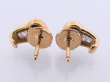 a pair of gold and diamond earrings