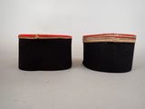 pair of black and red velvet boxes with gold trims