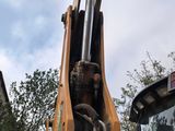 an image of a construction vehicle with a crane attached to it ' s back