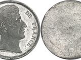 a close up of a coin with a woman ' s face on it