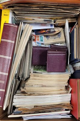 a box full of books and papers sitting on a table