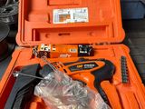 a tool in the orange case on the floor