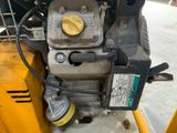 a close up of a small engine on a construction vehicle