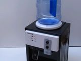 a water dispenser sitting on top of a counter