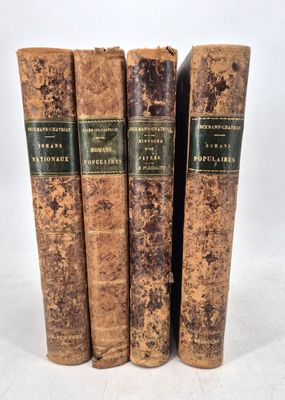 three old books sitting on top of each other on a white surface