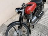 a motorcycle that is parked on the side of the street