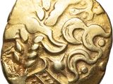 a gold coin with an image of a man riding a horse