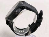 a close up of a watch on a clear stand