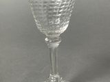 a wine glass that is sitting on a table