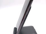 a cell phone that is sitting on top of a stand