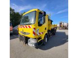 a picture of a yellow truck parked in a parking lot