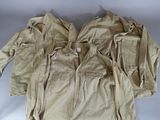 several jackets and pants are laid out on a white surface
