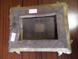 a picture of a wooden picture frame on a table