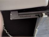 a close up of a phone on the seat of a plane