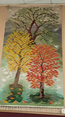 a picture of a tapestry hanging on the wall