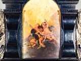 a clock with a picture of a woman and a child on it